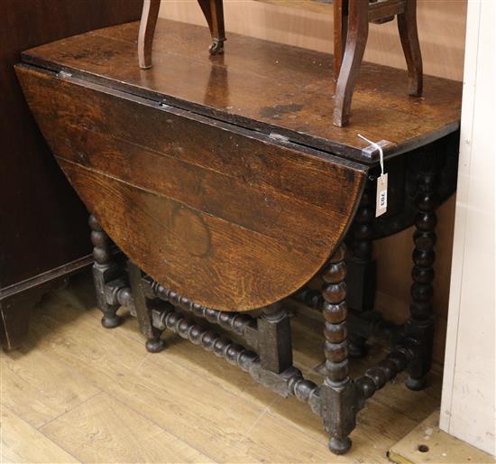 An 18th century oak oval topped gateleg table Length 100cm